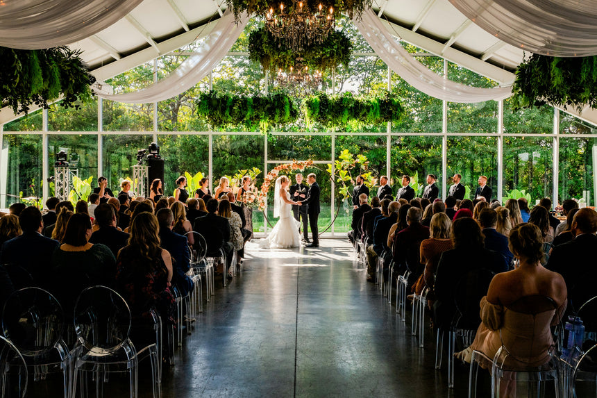 Bride and groom exchanging vows during an elegant indoor wedding ceremony