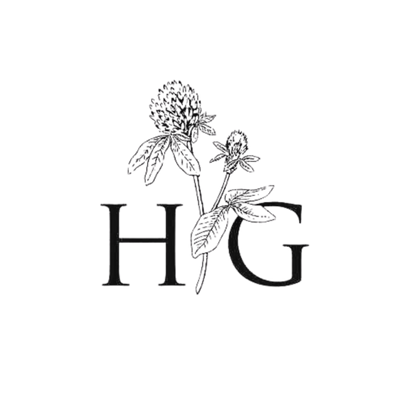 A black botanical monogram logo featuring the letters H and G with a line-art clover illustration between them, centered on a plain white background.