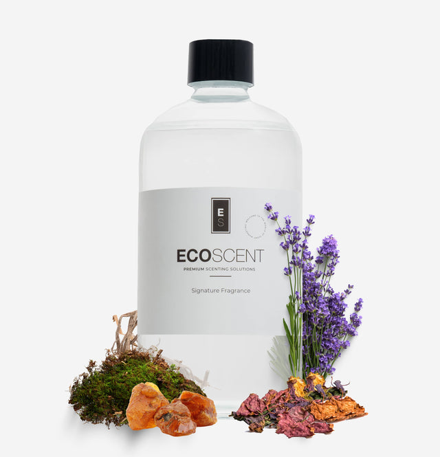 Ecoscent-shop Amber, Vetiver & Moss Fragrance Oil in a clear plastic bottle, labeled with 'ECO SCENT' and 'Signature Fragrance,' surrounded by dried moss, amber pieces, and lavender flowers.
