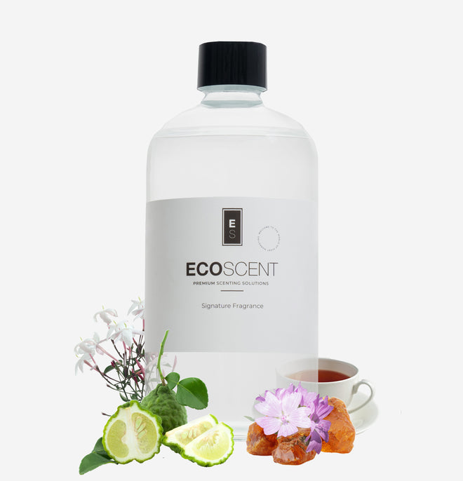 Ecoscent-shop Amber, Bergamot & Jasmine Fragrance Oil in a clear bottle with a black cap, featuring a neutral label indicating it as a signature fragrance. Surrounding elements include bergamot, jasmine flowers, and amber pieces.