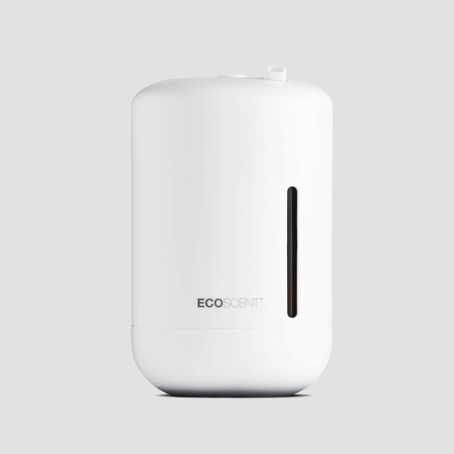 EcoScent Ariel wall-mounted scent machine in white, designed for small commercial spaces and bathrooms up to 100m³, featuring a sleek cylindrical body and a visible fragrance output window.