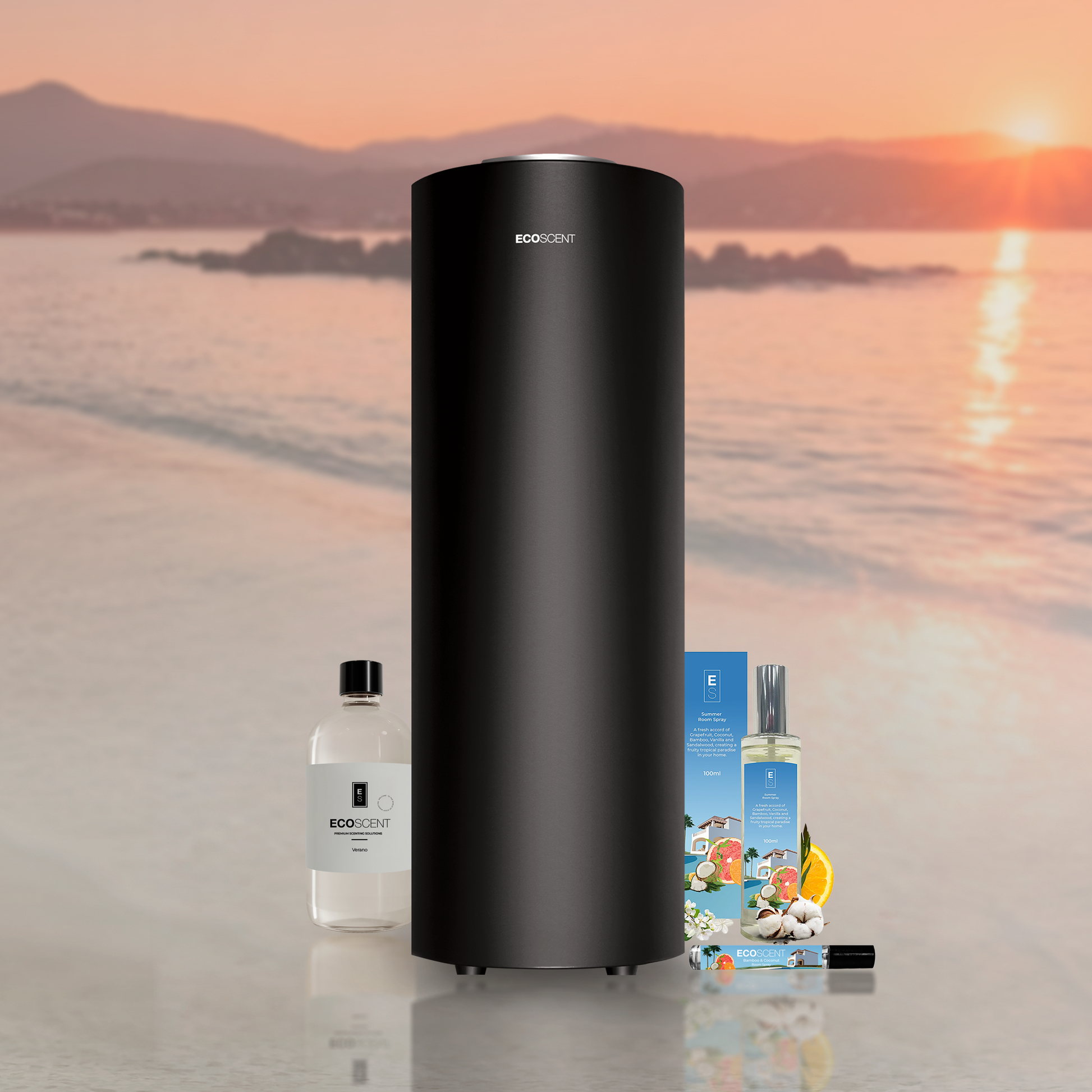 Black cylindrical scent machine, small bottle, and packaging on a reflective surface with a scenic background.