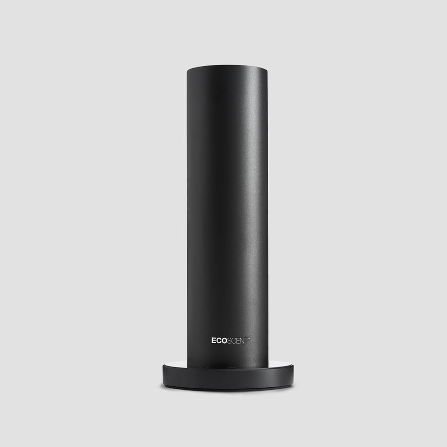 A tall, cylindrical black scent system device with the EcoScent brand logo on the front.