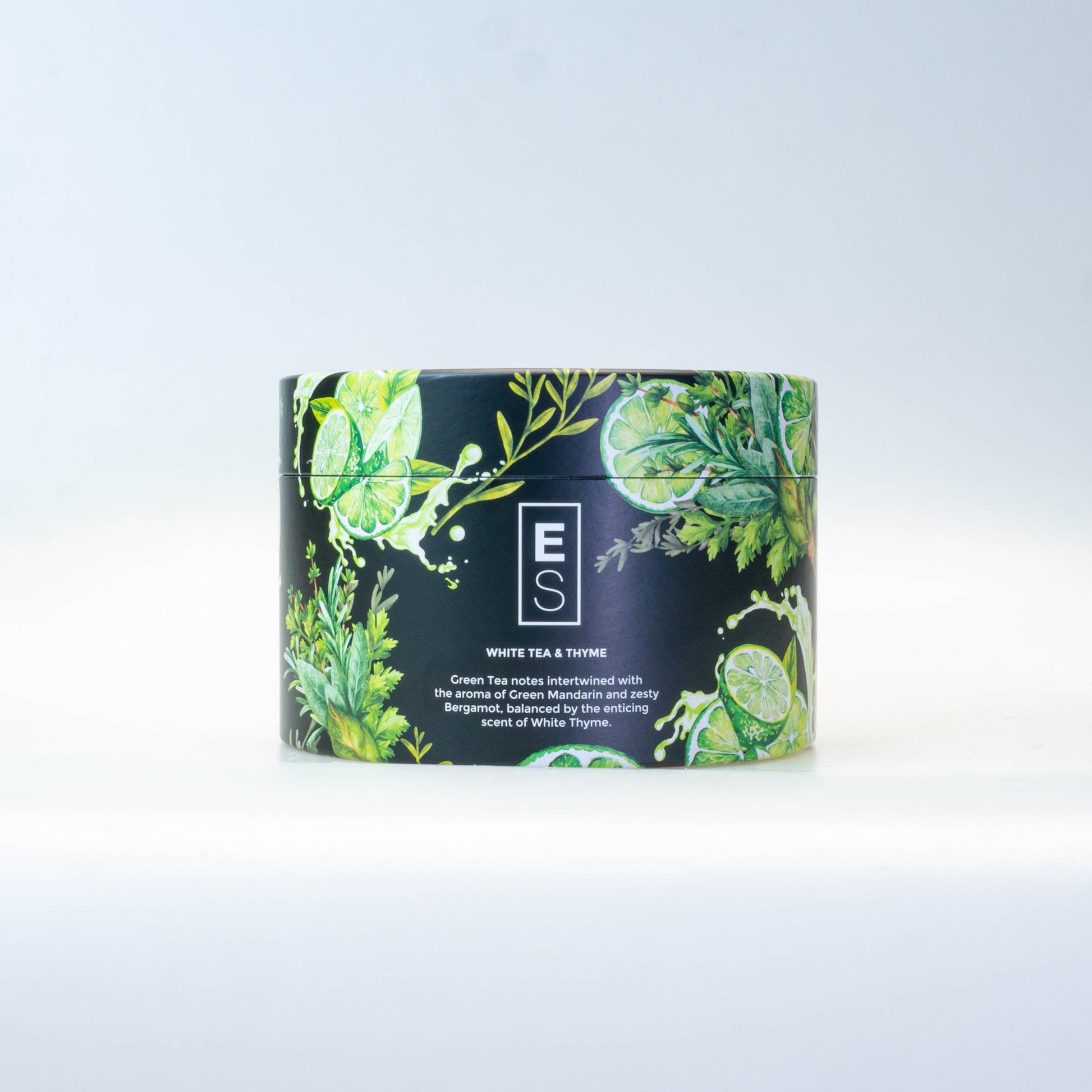 Candle with decorative packaging on a white surface