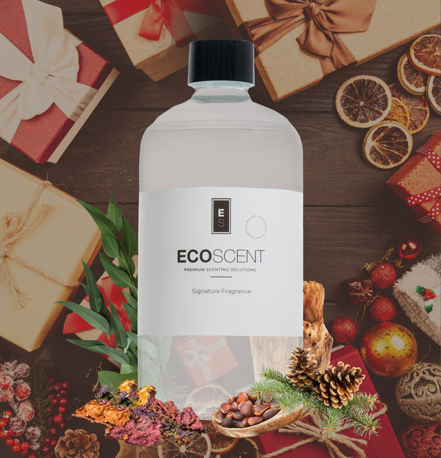 ecoscent-shop Christmas Tree Pine Cone Fragrance Oil featuring pine, cedarwood, and balsam scents, presented in a clear bottle with a black cap, surrounded by holiday-themed decorations and natural elements.
