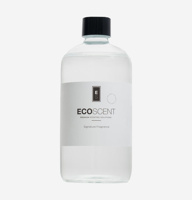 ecoscent-shop Attar Oudh Fragrance Oil featuring a blend of Oudh, Amber, and Sandalwood in a clear bottle with a black cap, labeled as "Signature Fragrance."
