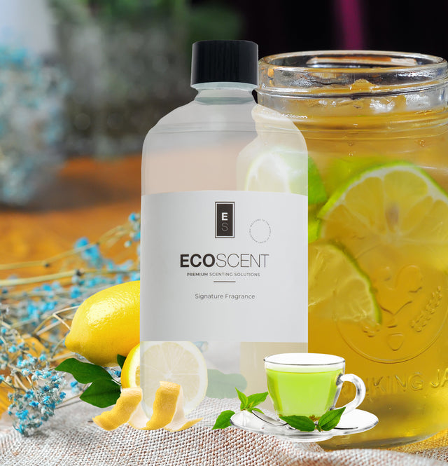 Ecoscent-shop Lemon Tea Delight Fragrance Oil featuring green tea, lemon, and musk scents, presented in a clear bottle with a black cap, displayed beside a jar of iced tea with lemon slices.