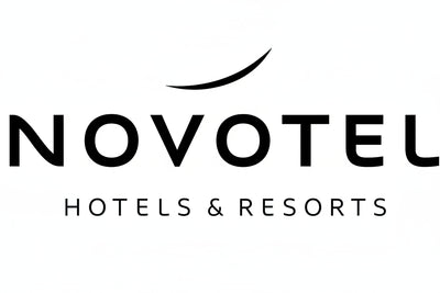 Novotel Hotels & Resorts logo in black text on a white background, with a curved line above the wordmark.