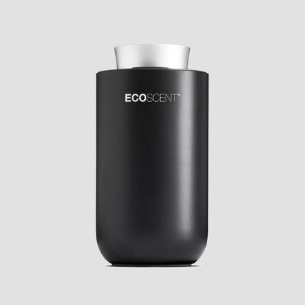 EcoScent Premium Scent Solutions EcoScent Puck – Battery Portable Scent Machine in black and silver, designed for use in cars, bathrooms, and small spaces, effectively covering areas up to 100m³.