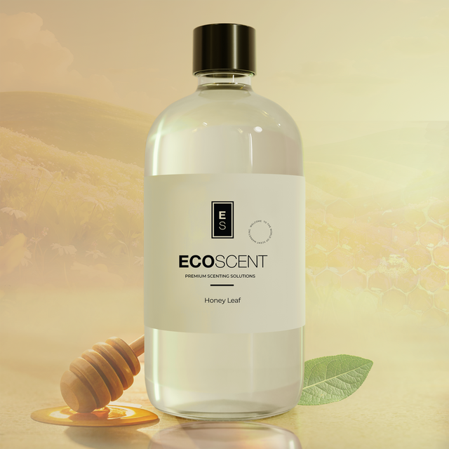 Bottle of Ecoscent Honey Leaf product with a honey dipper and leaf on a warm-toned background