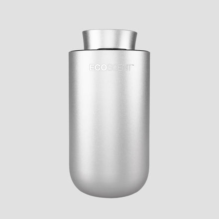 EcoScent Premium Scent Solutions EcoScent Puck battery portable scent machine in silver, designed for use in cars, bathrooms, and small spaces, covering areas up to 100m³.