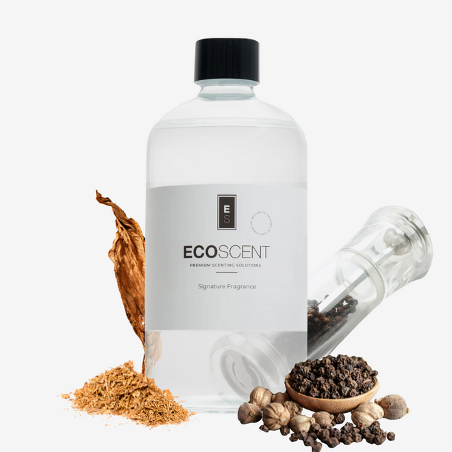 ecoscent-shop Tobacco & Black Pepper Fragrance Oil in a clear glass bottle with a black cap, surrounded by tobacco leaves, black pepper, and spices, showcasing the signature fragrance's natural ingredients.