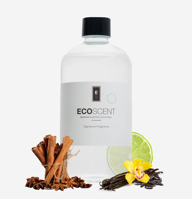 ecoscent-shop Vanilla & Tonka Fragrance Oil in a clear bottle, featuring a sleek design. The image includes cinnamon sticks, lime, and vanilla orchid alongside the bottle, emphasizing the fragrance's key notes.