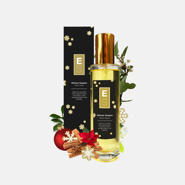 EcoScent Premium Scent Solutions Winter Season Long-Lasting Room Spray in 100ml size, presented in a sleek glass bottle with a gold cap, featuring a black box with floral designs and the brand logo.