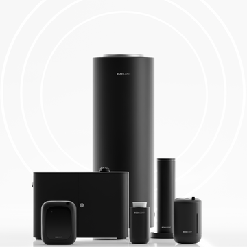Collection of black electronic scent machines on a white background