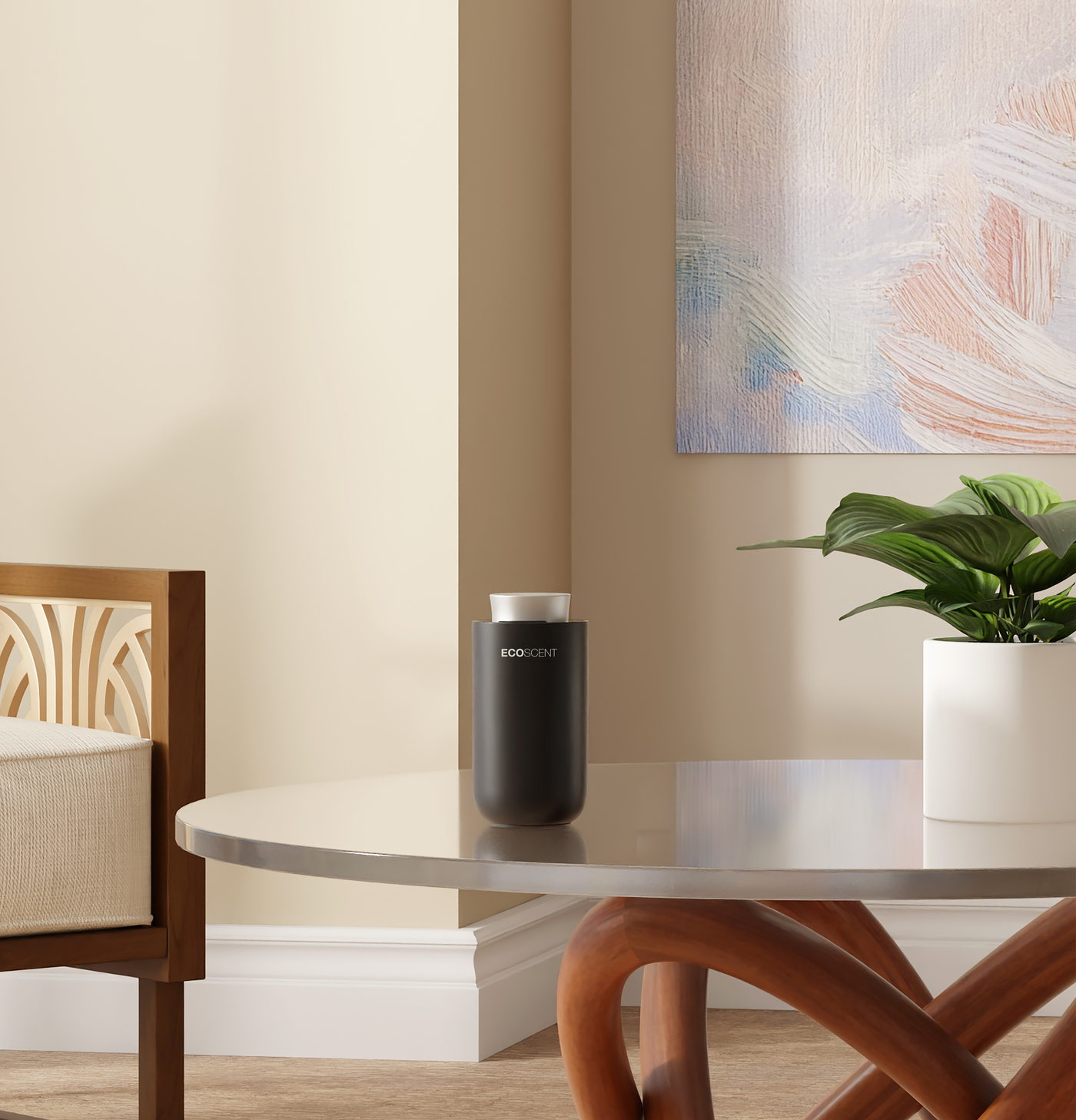 A matte black cylindrical portable scent machine with a white top cap sits on a round glass-top table in a modern living room setting with a potted plant and a wooden chair.
