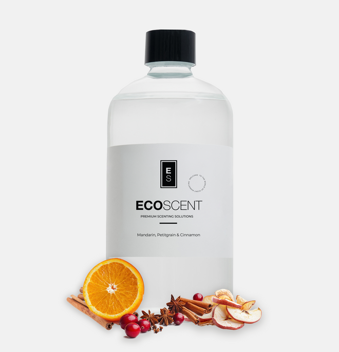 ecoscent-shop Mandarin, Petitgrain & Cinnamon Fragrance Oil in a clear bottle with a black cap. The bottle features a label displaying the product name and brand, accompanied by orange slices, cinnamon sticks, and dried fruits.