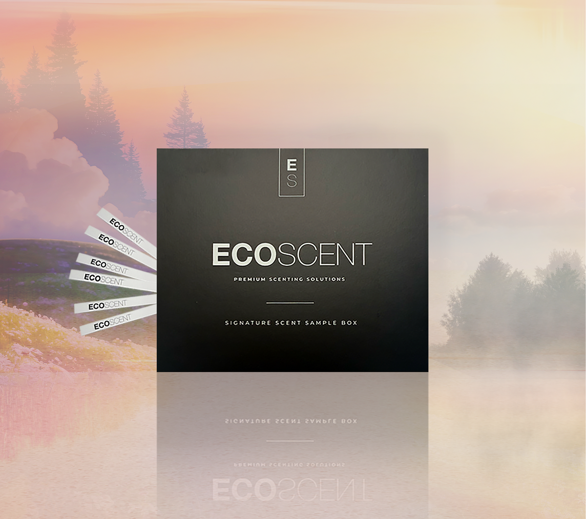 A dark charcoal/black square sample box labeled 'ECOSCENT' with a vertical 'Eco' mark, shown over a soft misty forest landscape with pink, orange, and beige sky tones. Several white side strips also read ECO / ECO 2020.